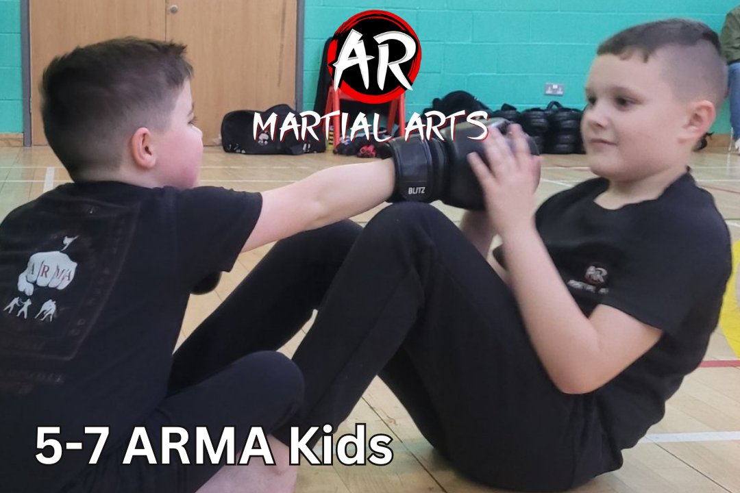 Two AR Martial Arts students aged five to seven practising pad work